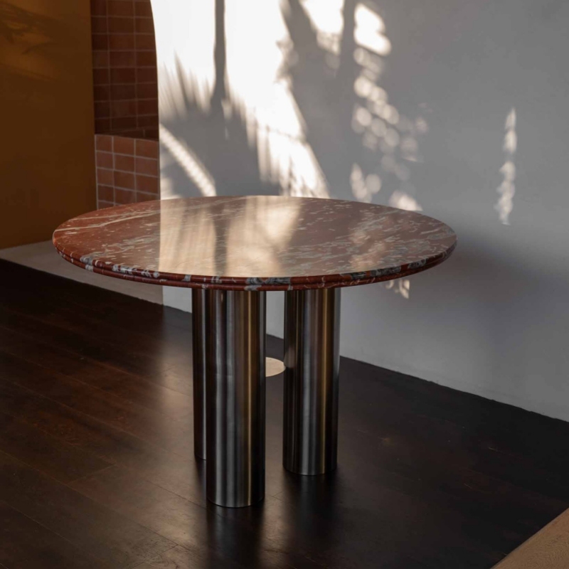 Round red marble accent table with stainless steel legs - minimalist modern living room centerpiece