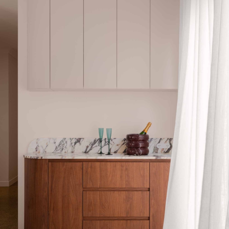 Marble Ribbed Ice Bucket on kitchen countertop with champagne & glasses - modern barware