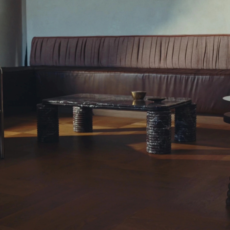 Rosso Levanto Marble Coffee Table in modern living room - styled with brown leather sofa