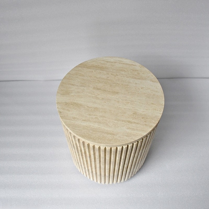 Oval travertine coffee table with vertical ribbed fluted sides - wabi-sabi accent furniture