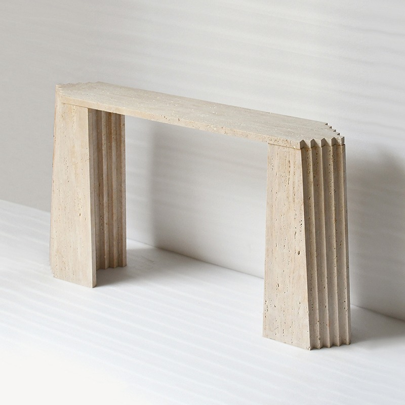 Beige travertine console table with fluted layered legs - modern sculptural entryway furniture